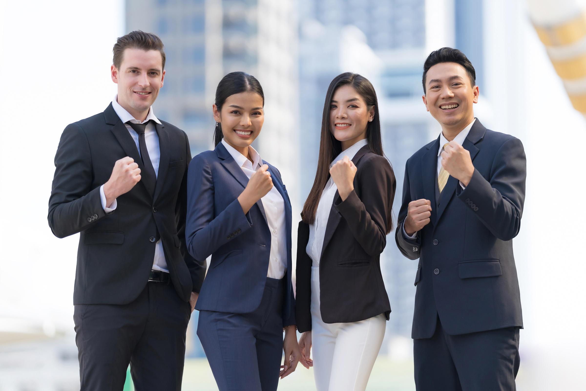 Four Executives in a Row, Business Team Standing and Cheering in